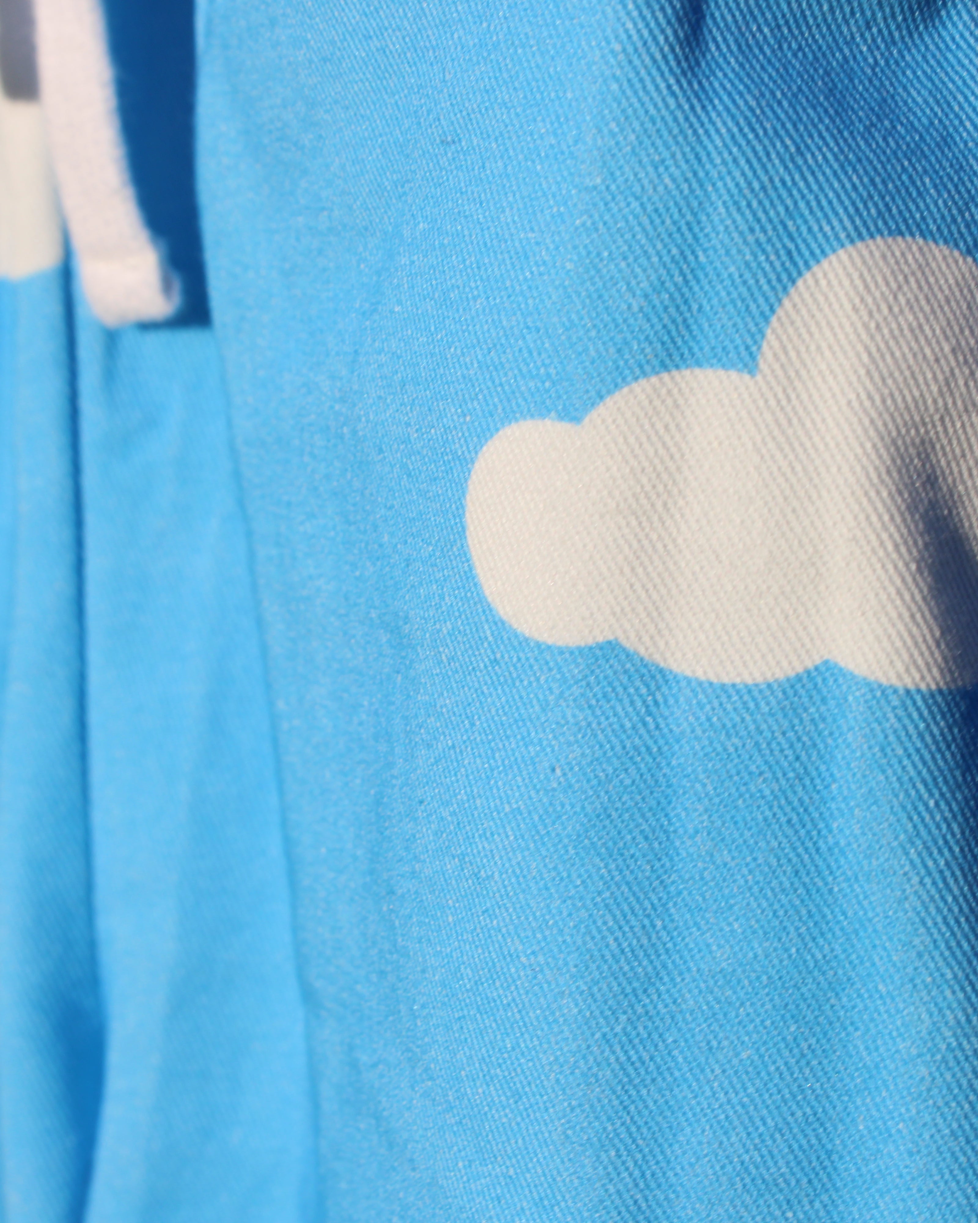 Cotton blue fabric with white cloud patterns