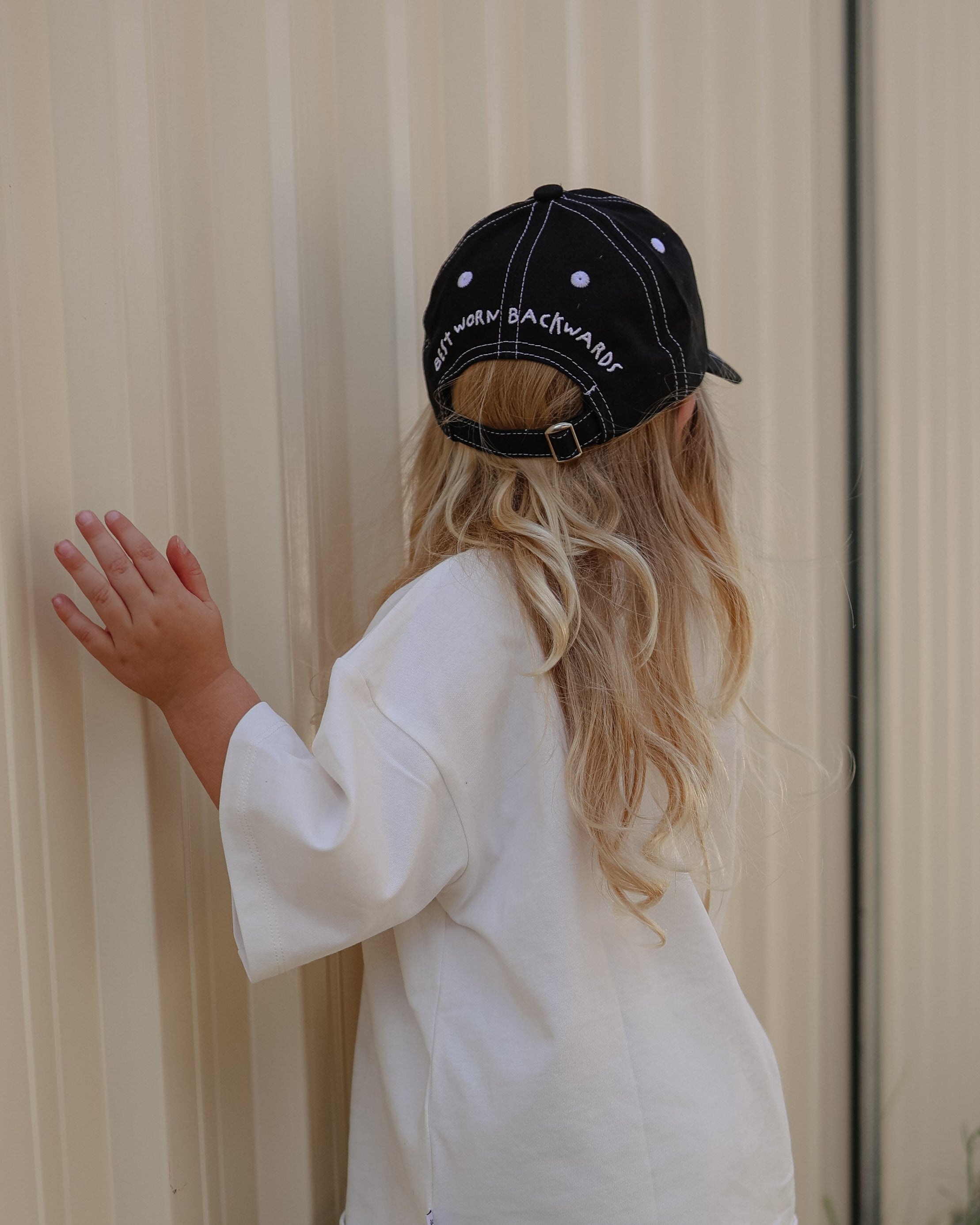 Citrus Circus Starburst OG tee and Best Worn Backwards cap - oversized kids white tee and black 6 panel cap with white stitching